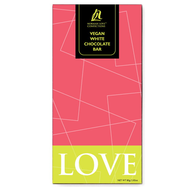 Vegan White Chocolate Bar in pink packaging on white background. Bar is rectangle and has lime green label with "LOVE" at the bottom.