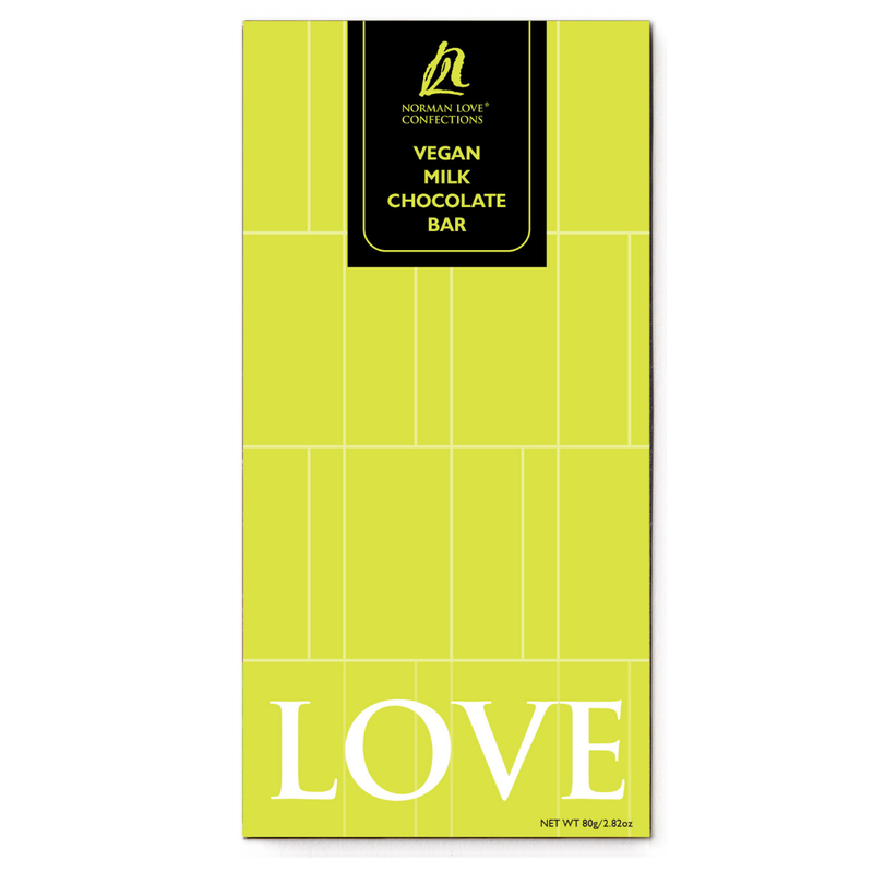 Wrapped Vegan Milk Chocolate Bar on white background. Bar is rectangle shaped in lime green packaging with "LOVE" at the bottom.
