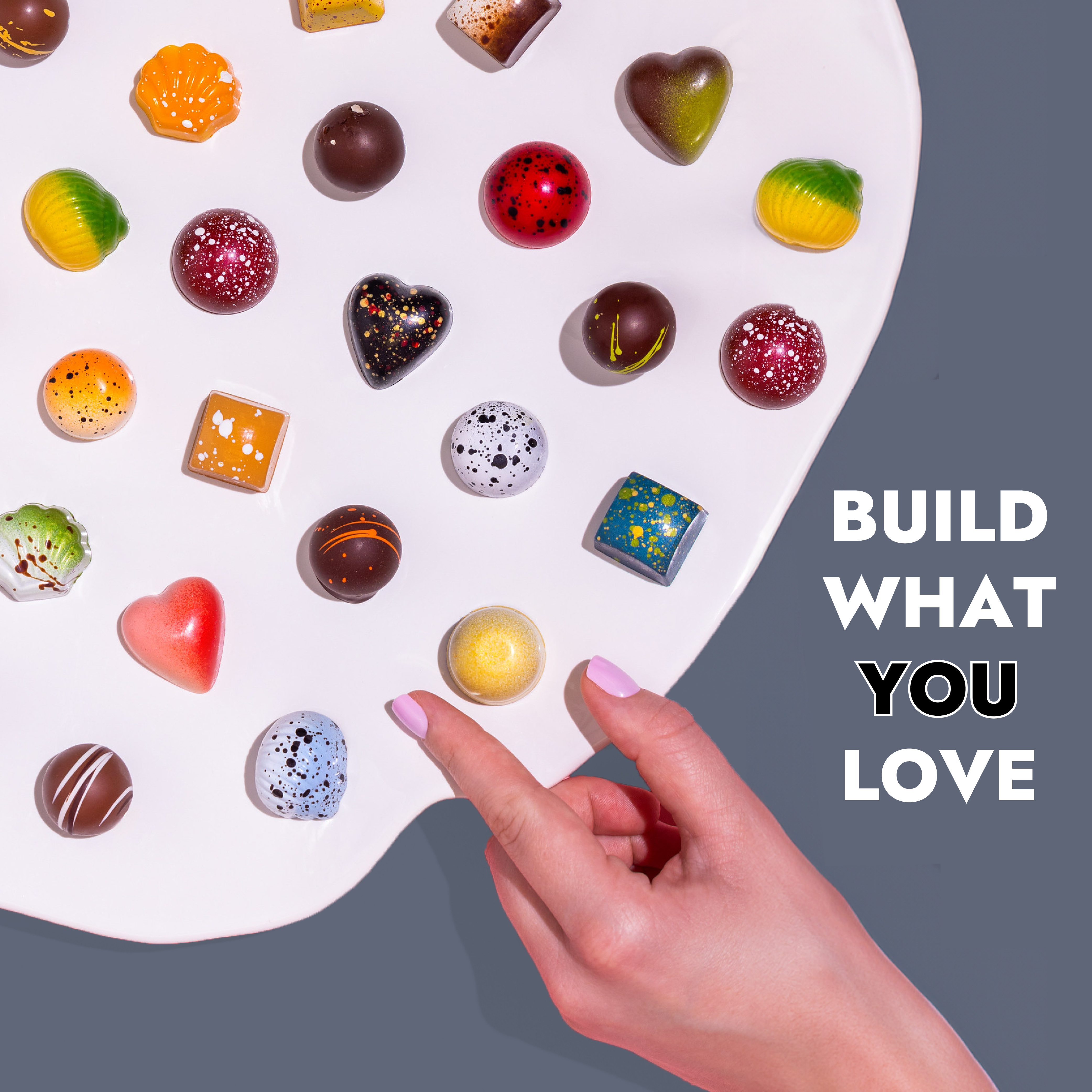 Artistic chocolates on a painter's palette 
