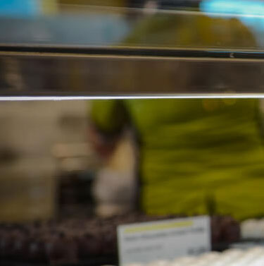 Glass display case featuring pastries and other bakery delights.