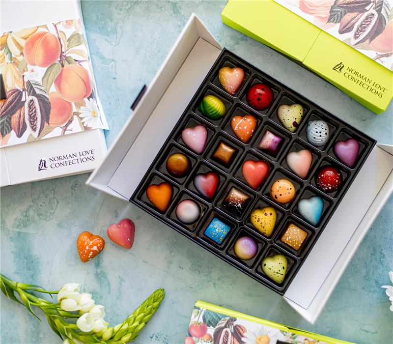12 count heart-shaped truffles on multi-colored background. 
